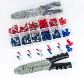 An opened assortment box containing crimp terminals, 261 pieces, with a black-blue colored crimping tool for crimp terminals in front of the assortment box.